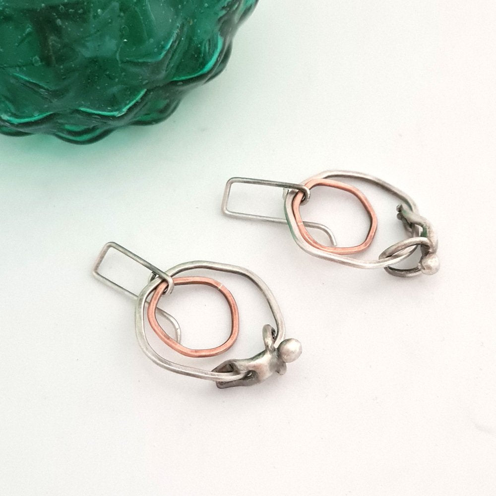 Silver and Copper Flat Rings Earrings with Little Men Hanging