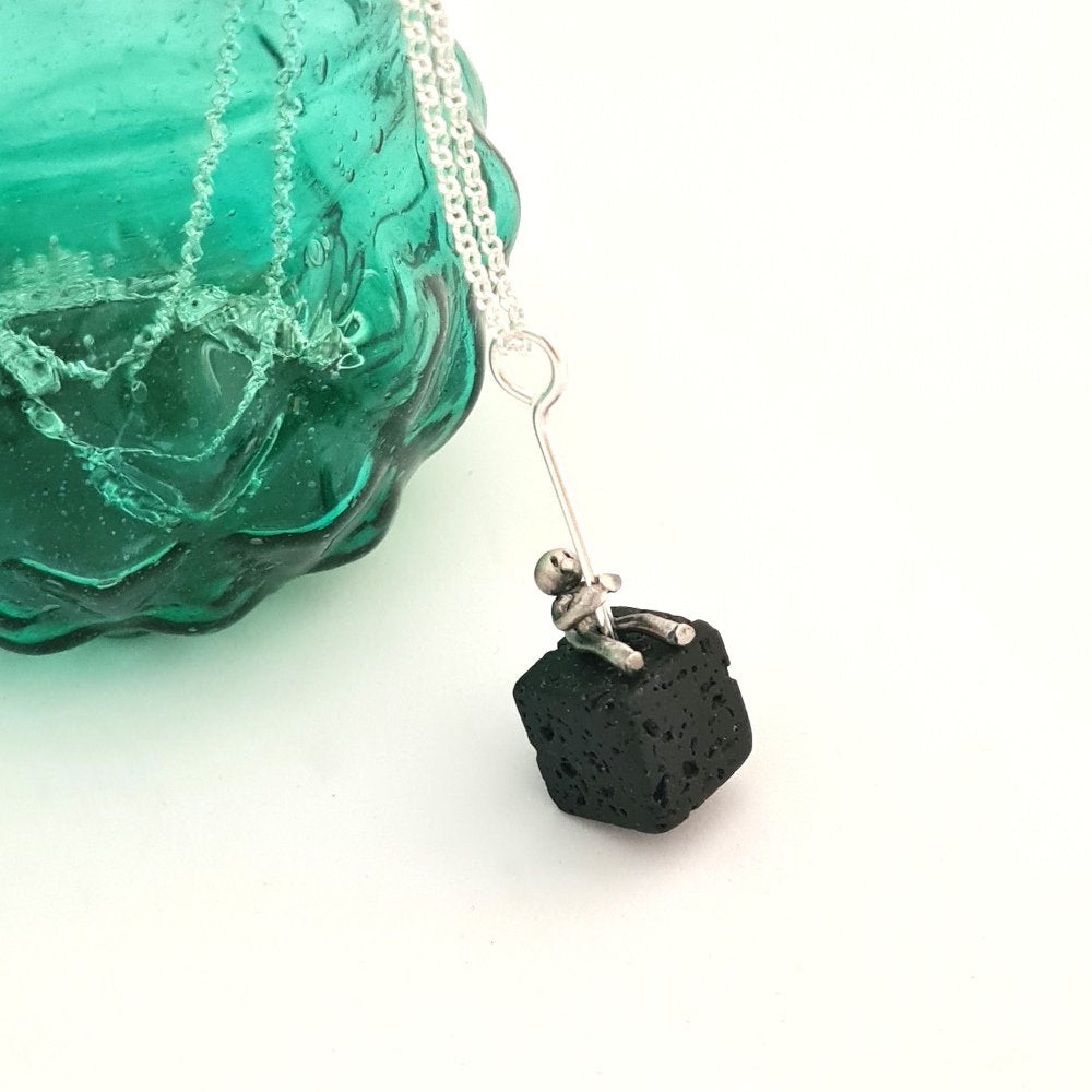 Volcanic Lava and Little Man Sitting