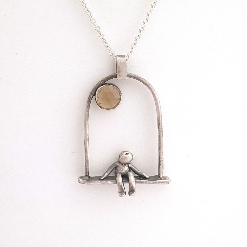 Little man sitting looking at the sun - Citrine quartz