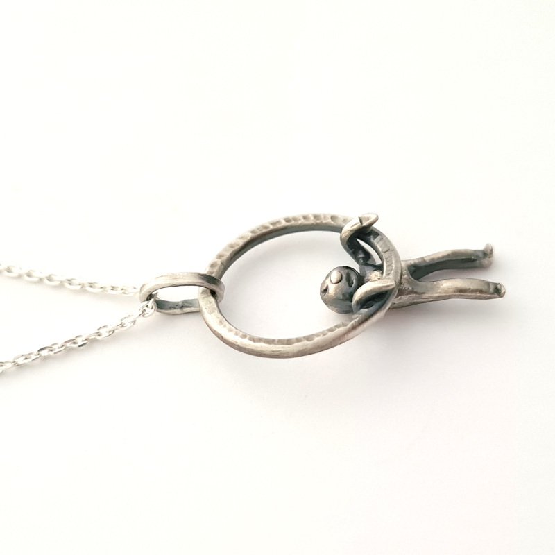 Small Hammered Ring With Little Man Hanging