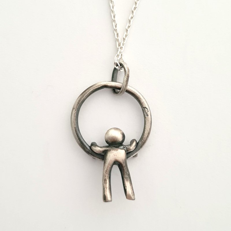 Small Hammered Ring With Little Man Hanging