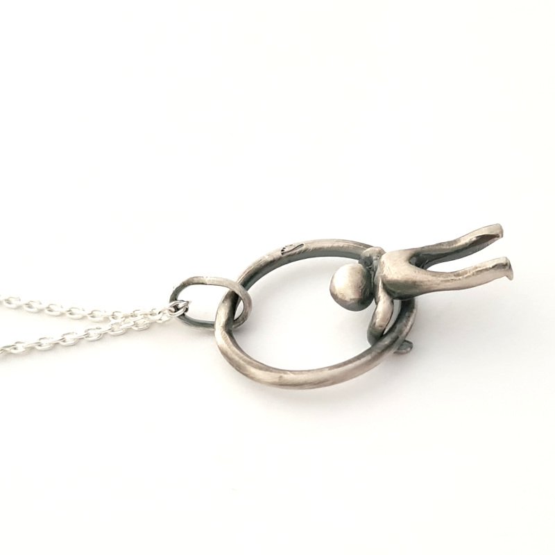 Small Hammered Ring With Little Man Hanging
